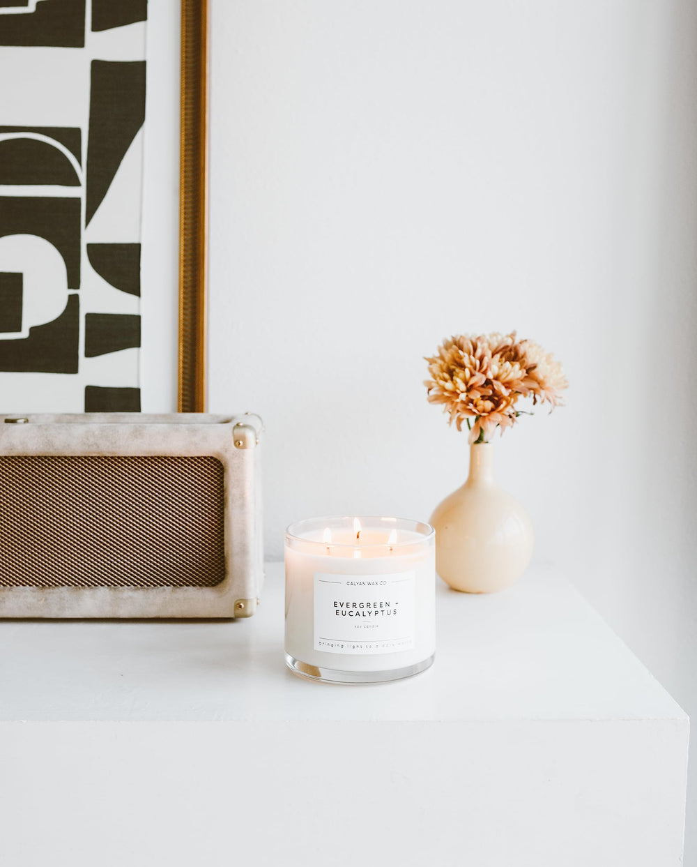 Calyan Wax Co Evergreen & Eucalyptus jar on a coffee table in modern decor