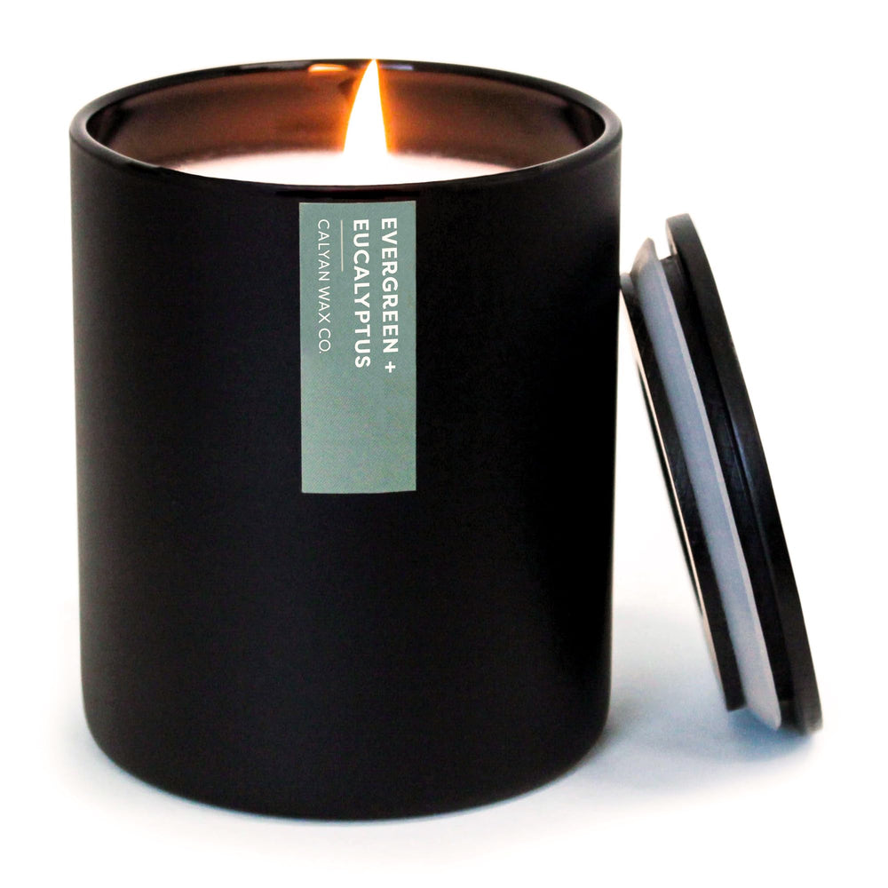 Calyan Wax Co Evergreen Eucalyptus candle in a black jar enriches home ambiance with a clean burn