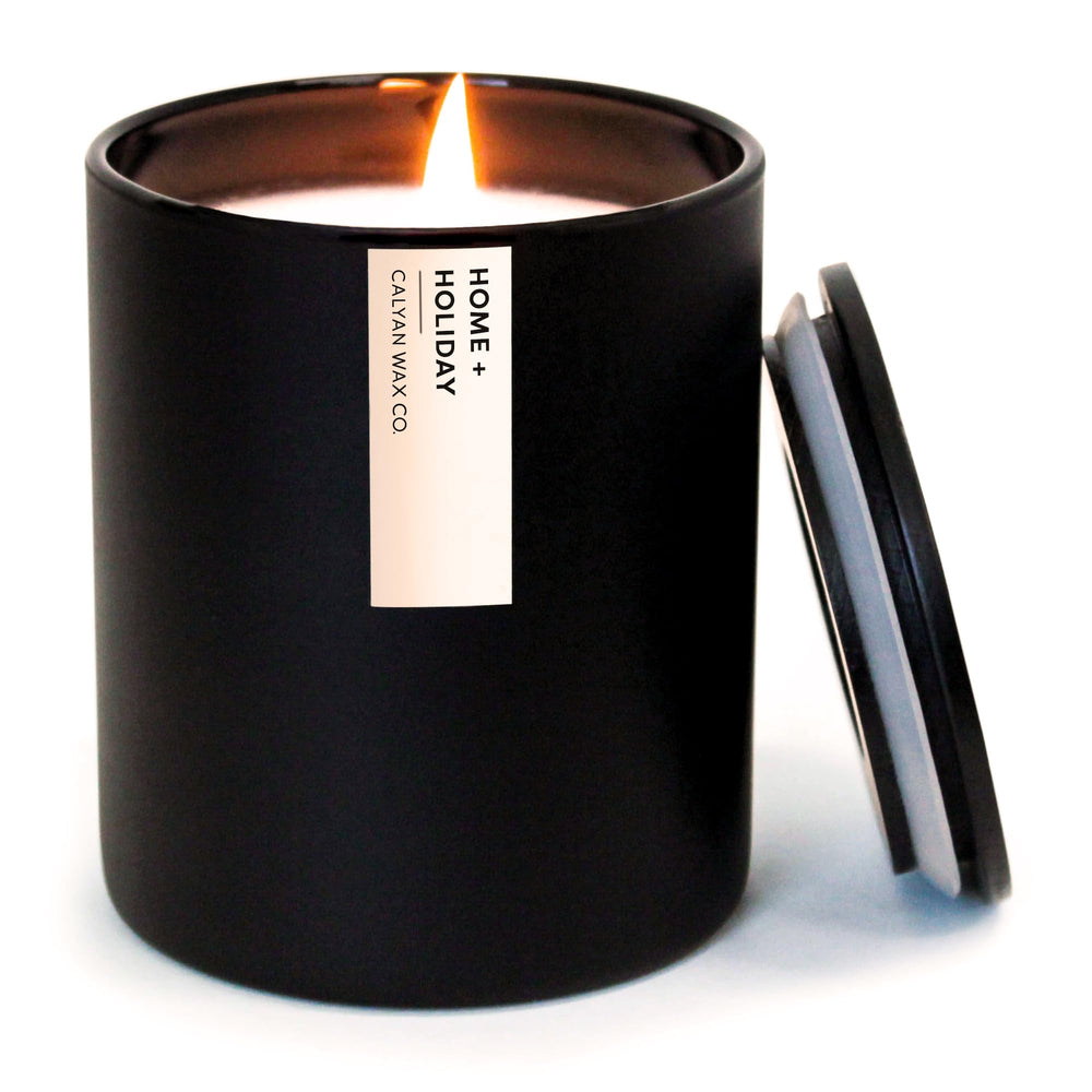 Calyan Wax Co Home Holiday Candle in amber vanilla glow for cozy ambiance.