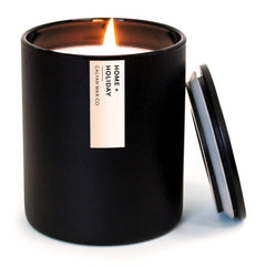 Calyan Wax Co Home Holiday Candle in amber vanilla glow for cozy ambiance.