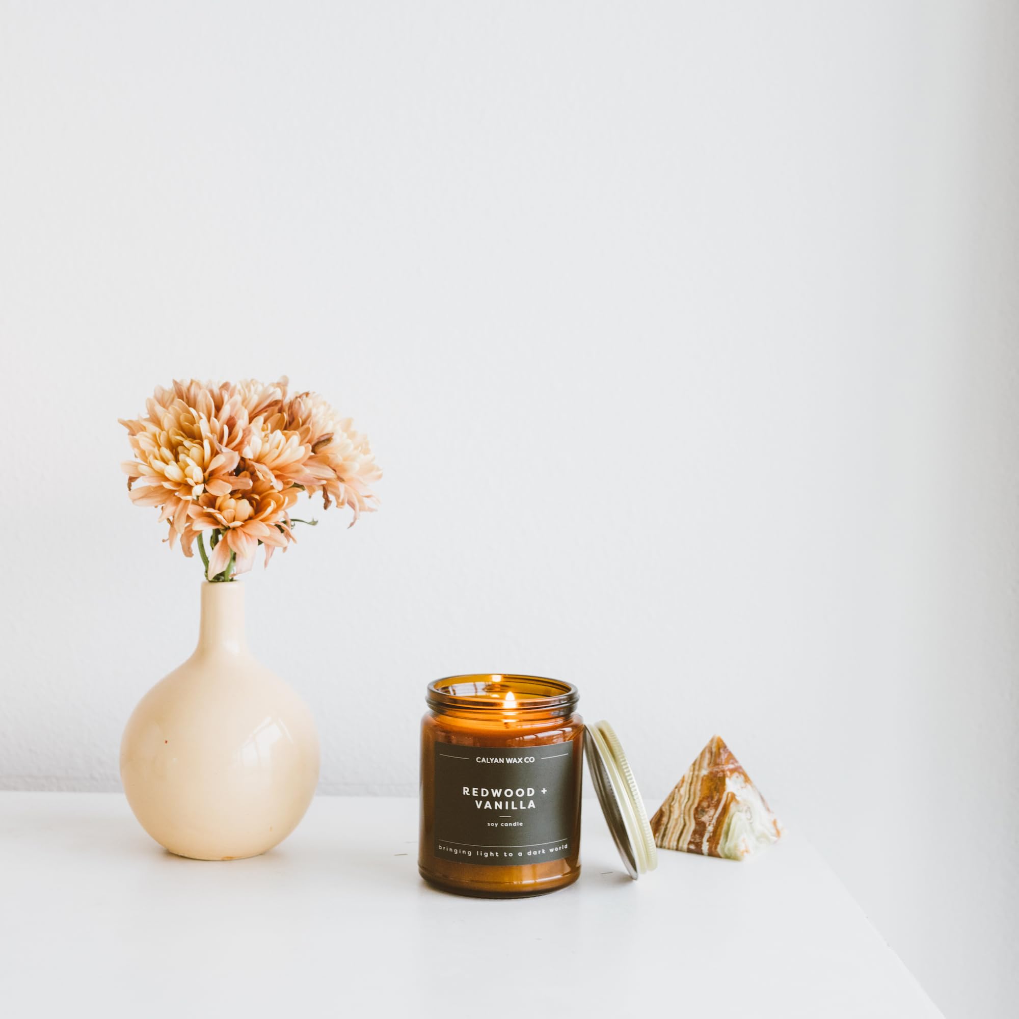 Calyan Wax Co. Redwood & Vanilla jar detail with amber glow