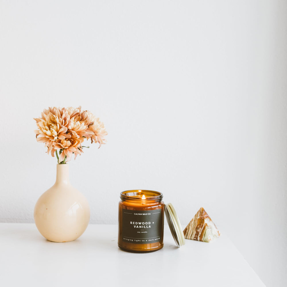Calyan Wax Co. Redwood & Vanilla jar detail with amber glow