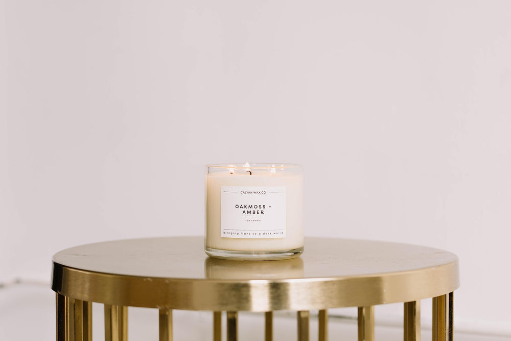 Calyan Wax Co. Seaside and Citrus glass candle glows softly for cozy evenings