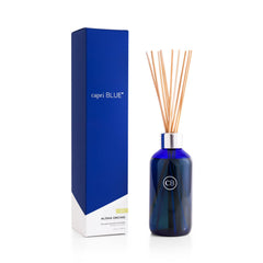 Capri Blue Aloha Orchid diffuser bottle in cobalt blue ready for stylish room fragrance.