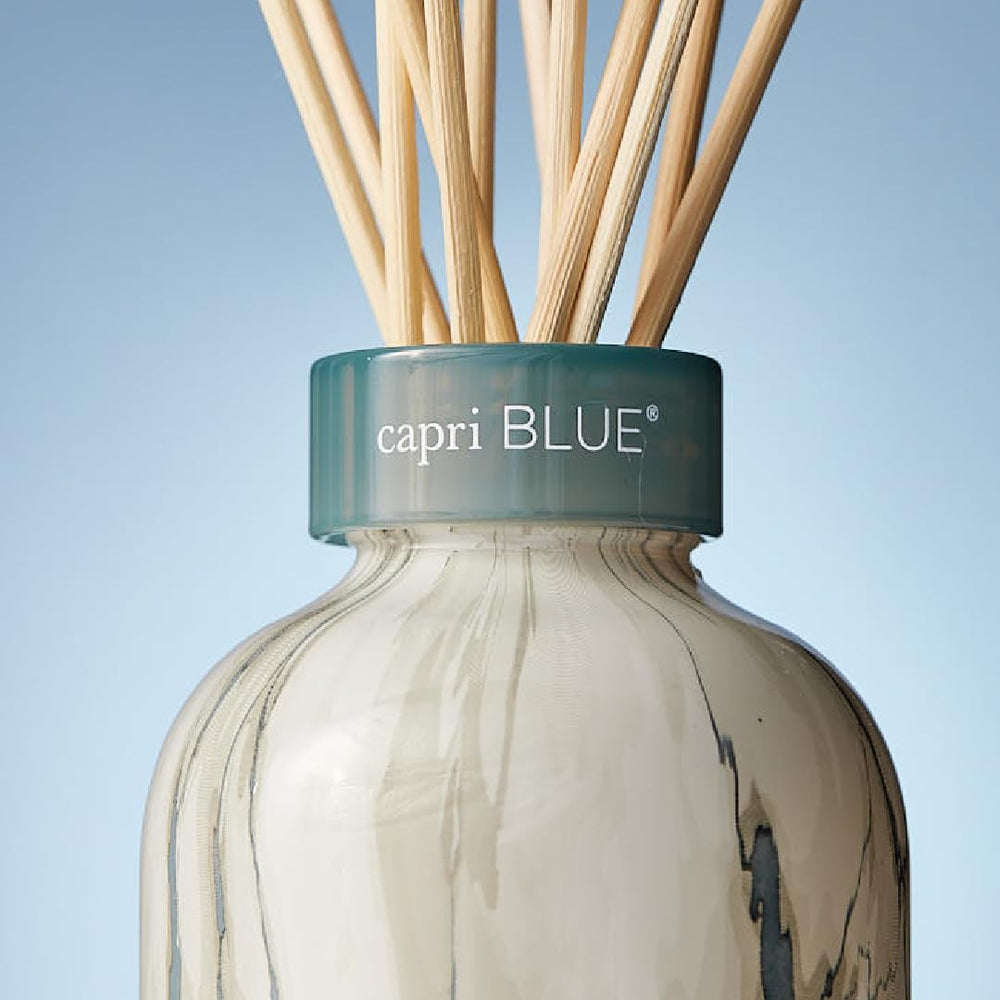 Capri Blue Modern Marble diffuser on nightstand for chic bedroom ambiance.