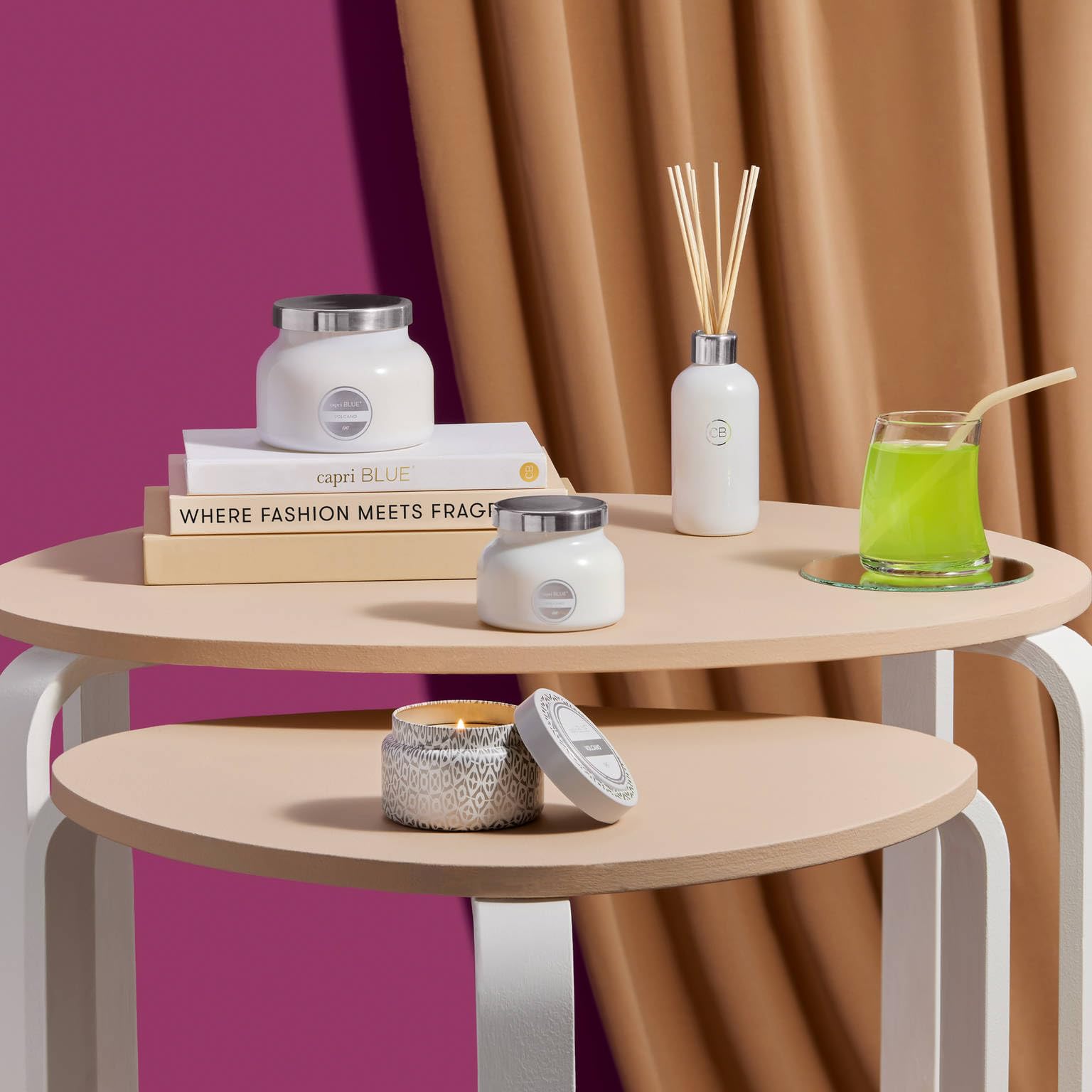 Capri Blue Volcano travel tin on coffee table adds refined scent touch to living spaces.