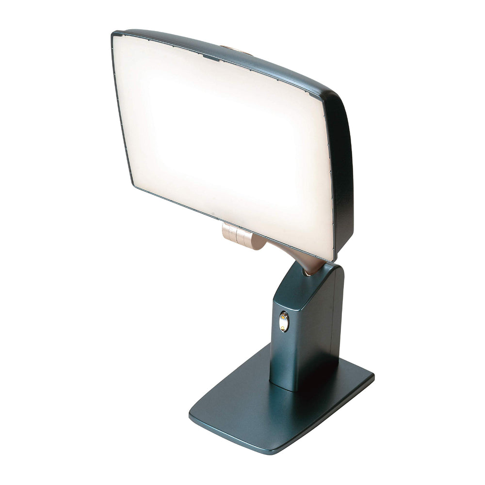Carex Day-Light Sky lamp on desk illustrates mood-enhancing light during morning routine.