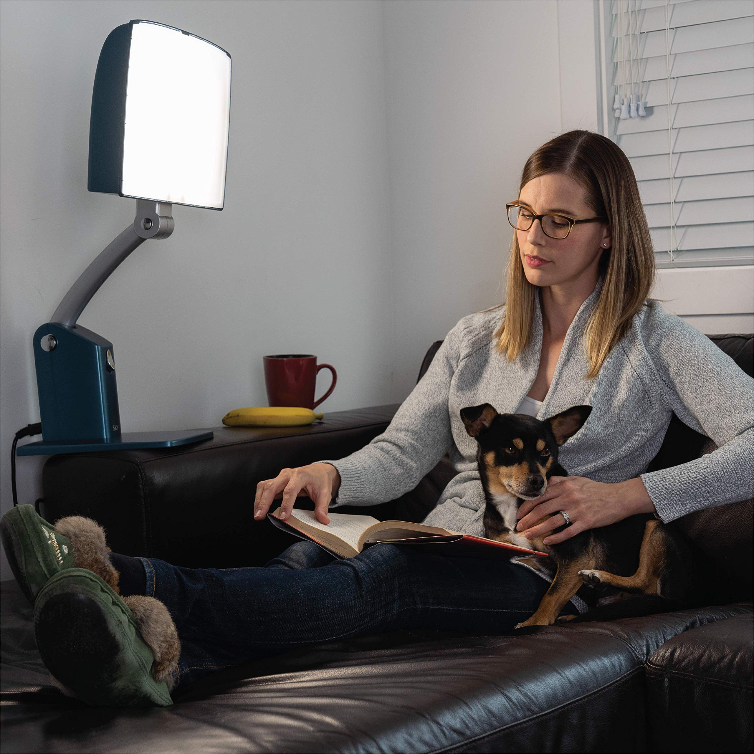 Carex Day-Light Sky side view with adjustable stand shows height customization for flexible placement.