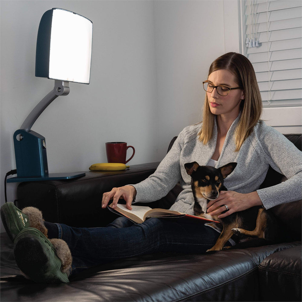 Carex Day-Light Sky side view with adjustable stand shows height customization for flexible placement.