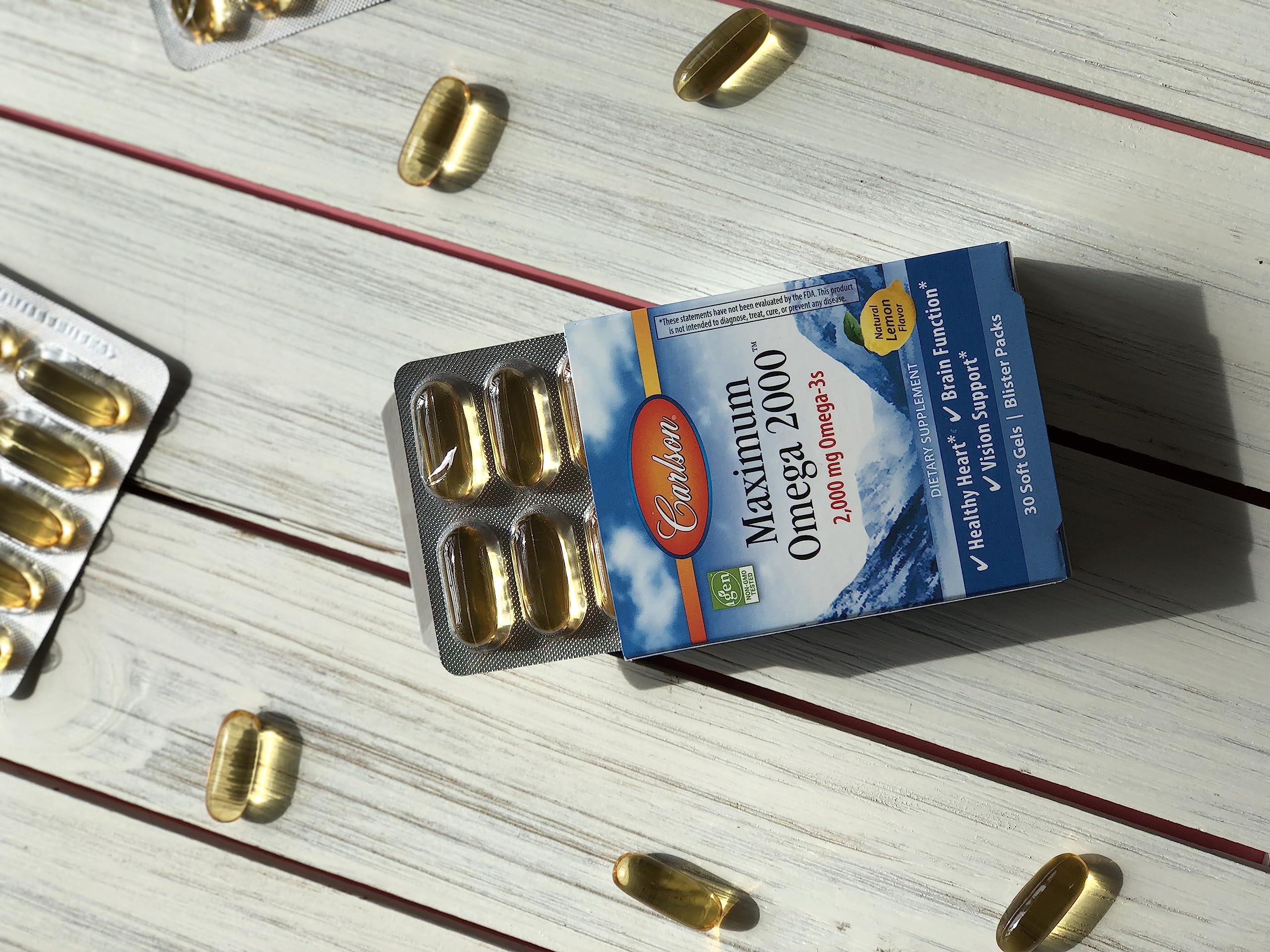 Carlson Maximum Omega 2000 bottle label highlights omega-3 source and quality.