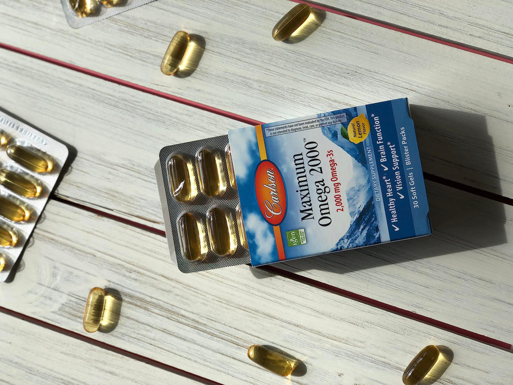Carlson Maximum Omega 2000 bottle label highlights omega-3 source and quality.