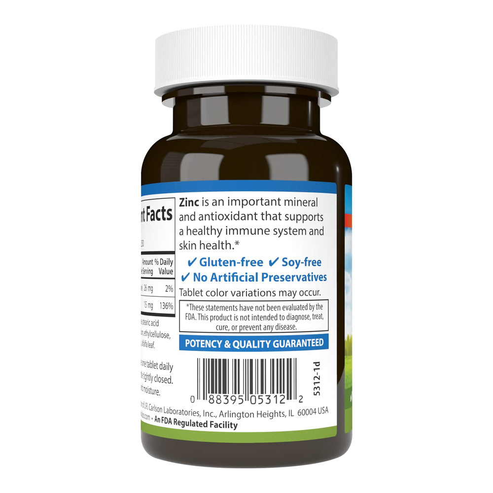 Close-up of zinc tablet with nutrition panel indicating 15 mg dosage for daily wellness.