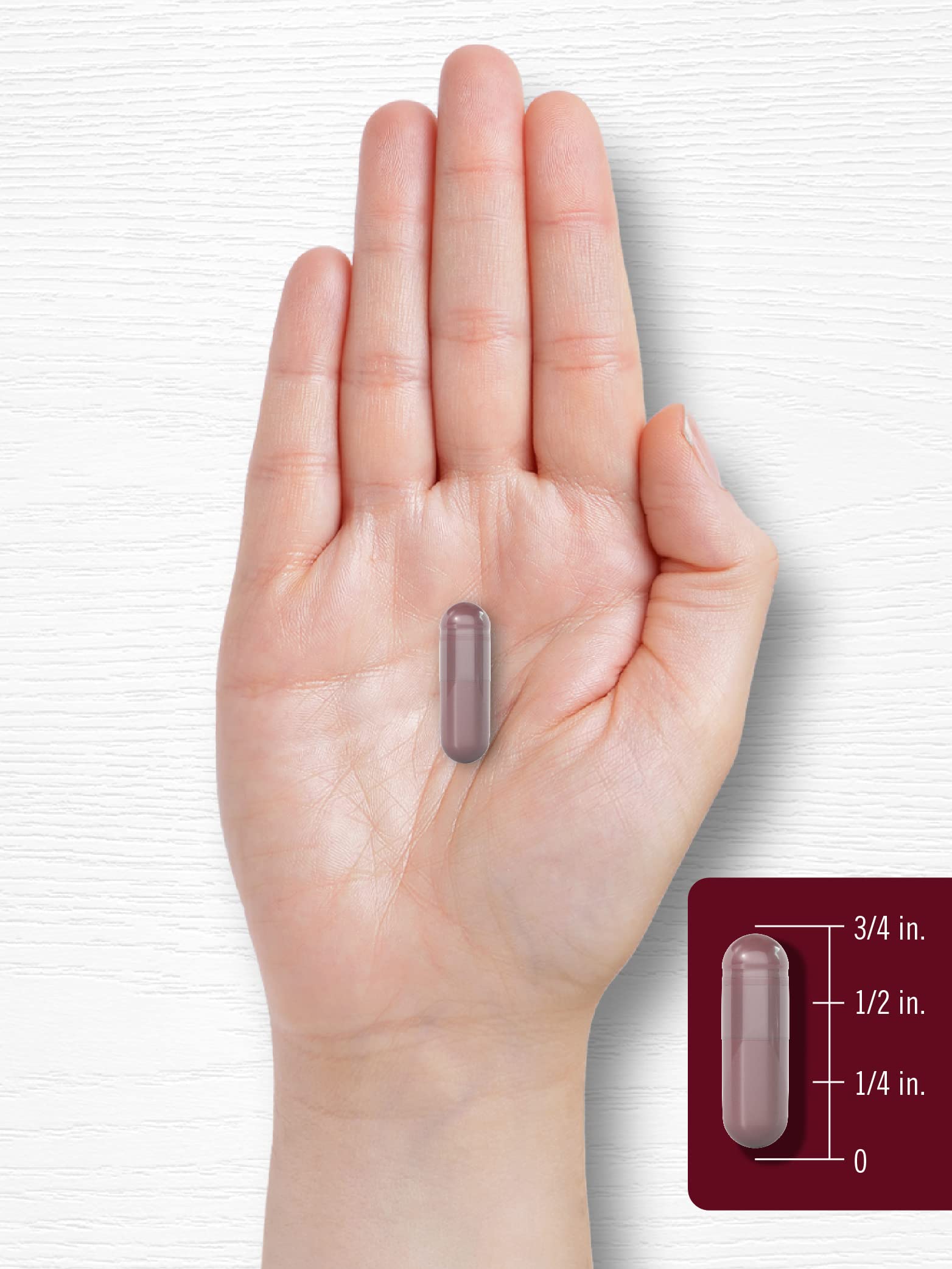 Glass of water with Carlyle Black Cherry Extract capsules ready to take.
