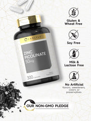 Carlyle Zinc Picolinate 50mg capsules beside water for easy ingestion.