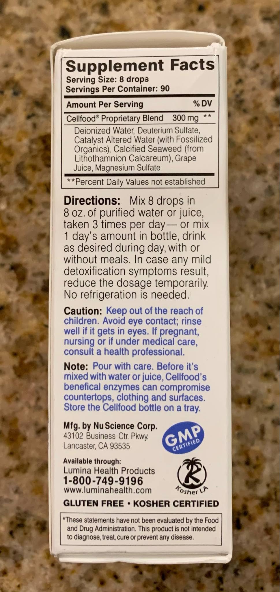 Cellfood Oxygen Boost dropper dispensing into liquid for easy dosing.