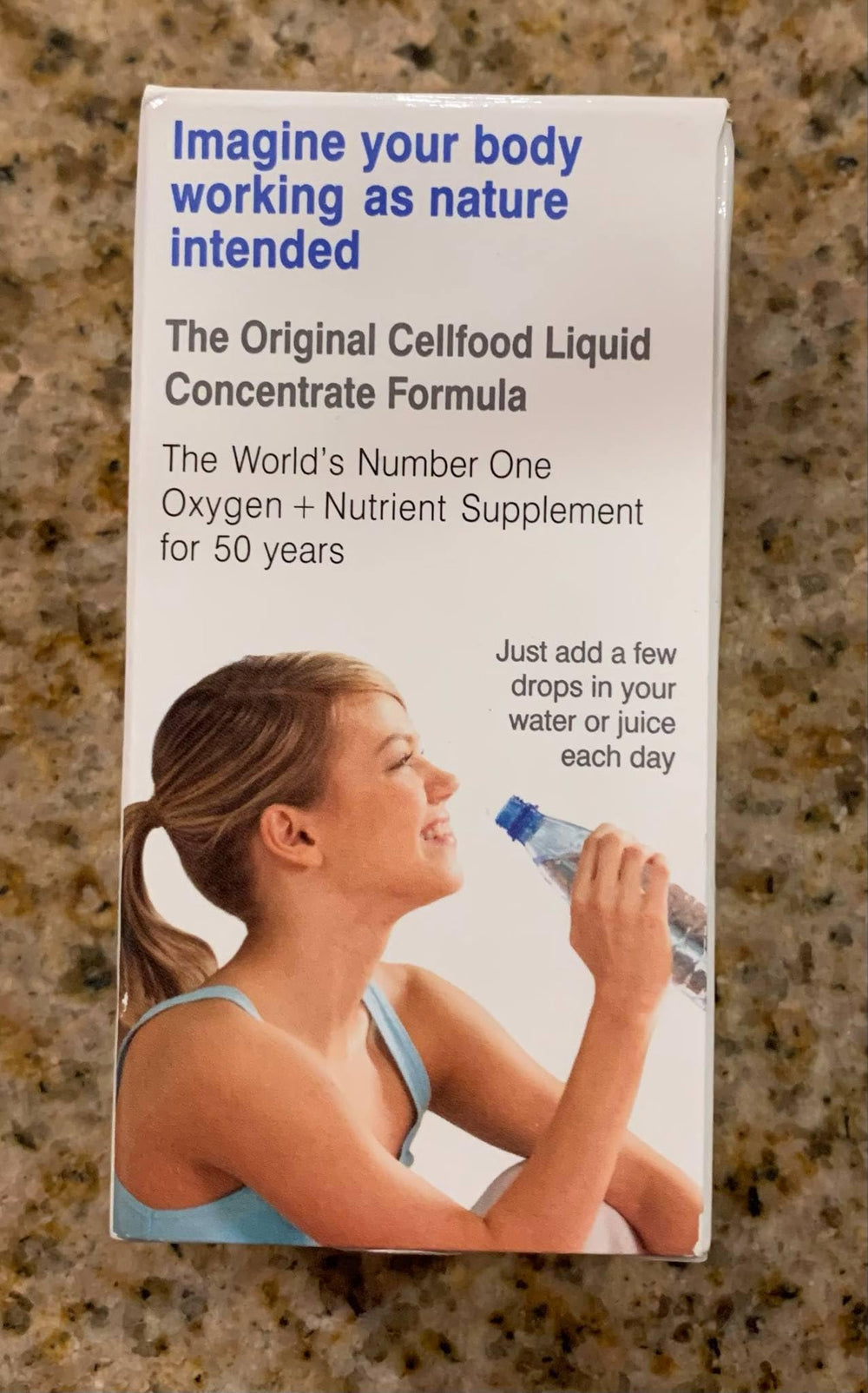 Glass of water with Cellfood Oxygen Boost drops mixing for routine use