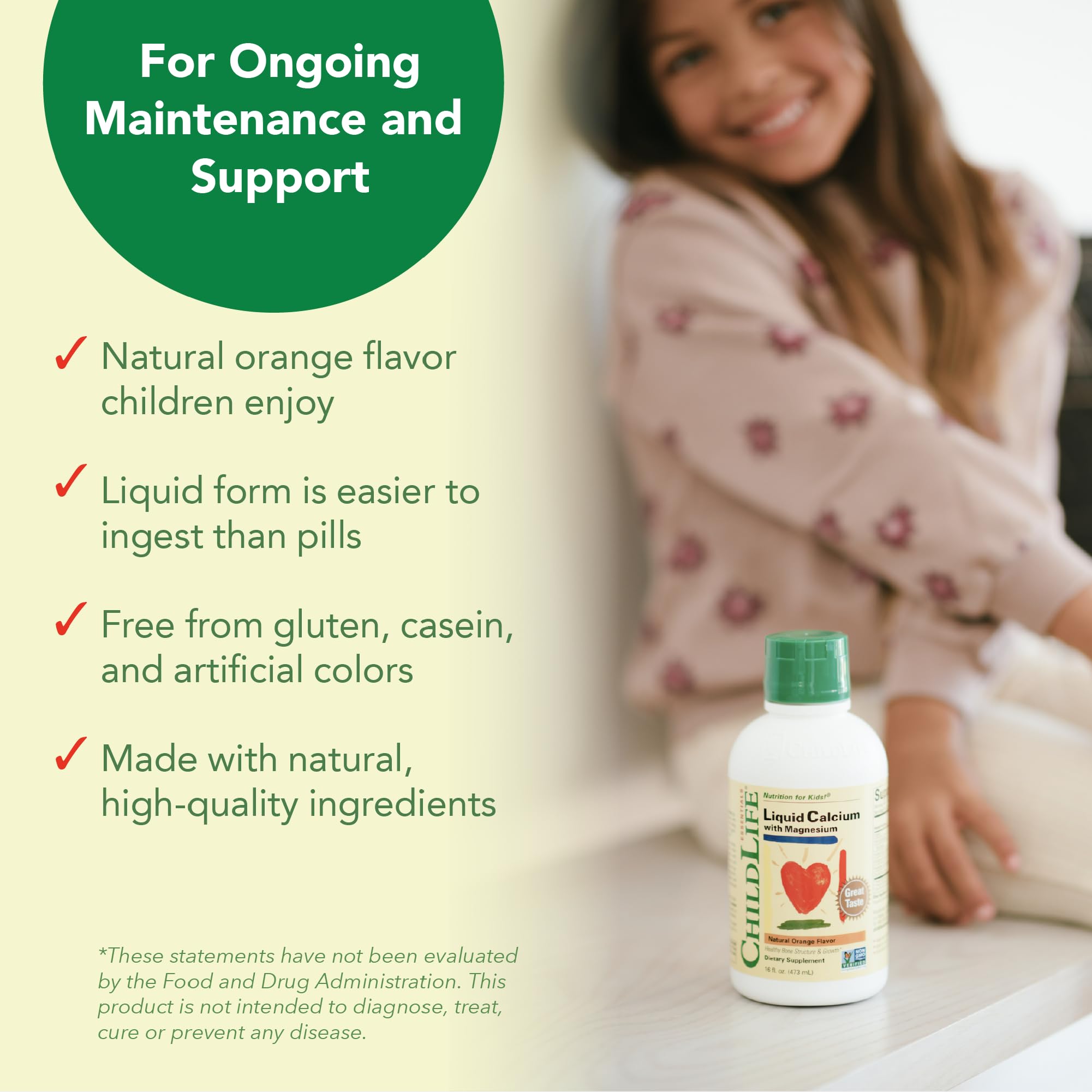 CHILDLIFE ESSENTIALS glass with orange liquid showing appealing kid beverage.