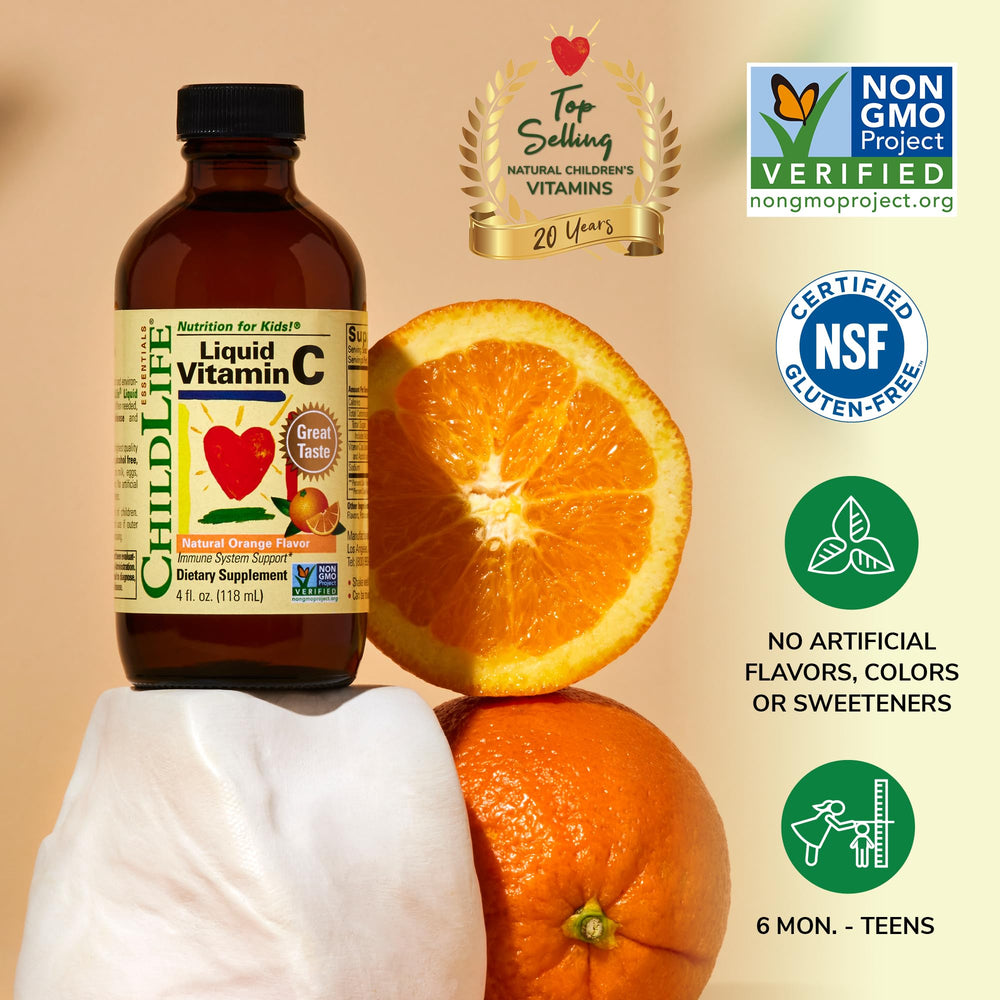 ChildLife Essentials vitamin C bottle beside a glass of water at mealtime