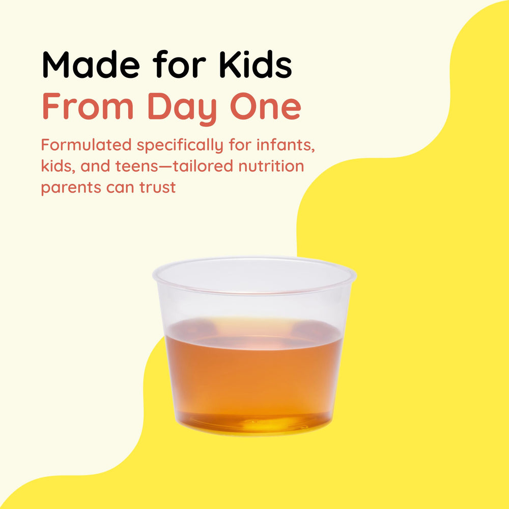 Caregiver giving CHILDLIFE Essentials Vitamin C to a child during routine