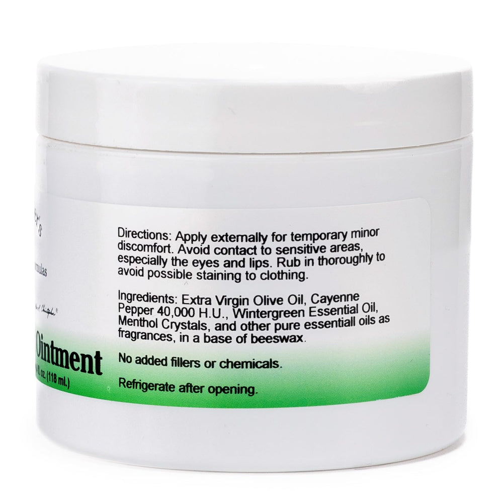 Applying Christopher's Cayenne Heat Ointment to skin for targeted comfort