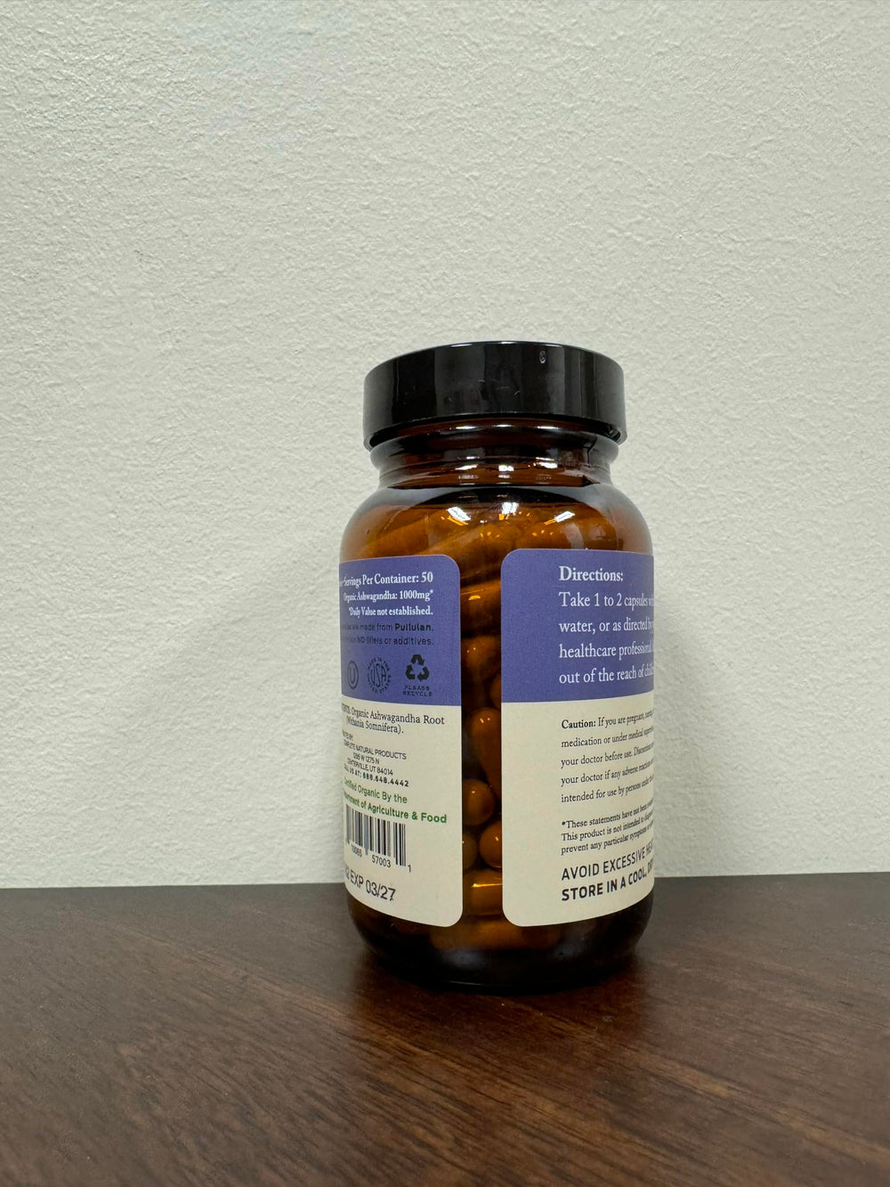 Complete Natural Ashwagandha capsules in hand for on-the-go stress support