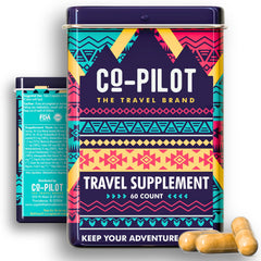 Co-Pilot Travel Vitamin bottle on a plane tray suggesting jet lag adaptation