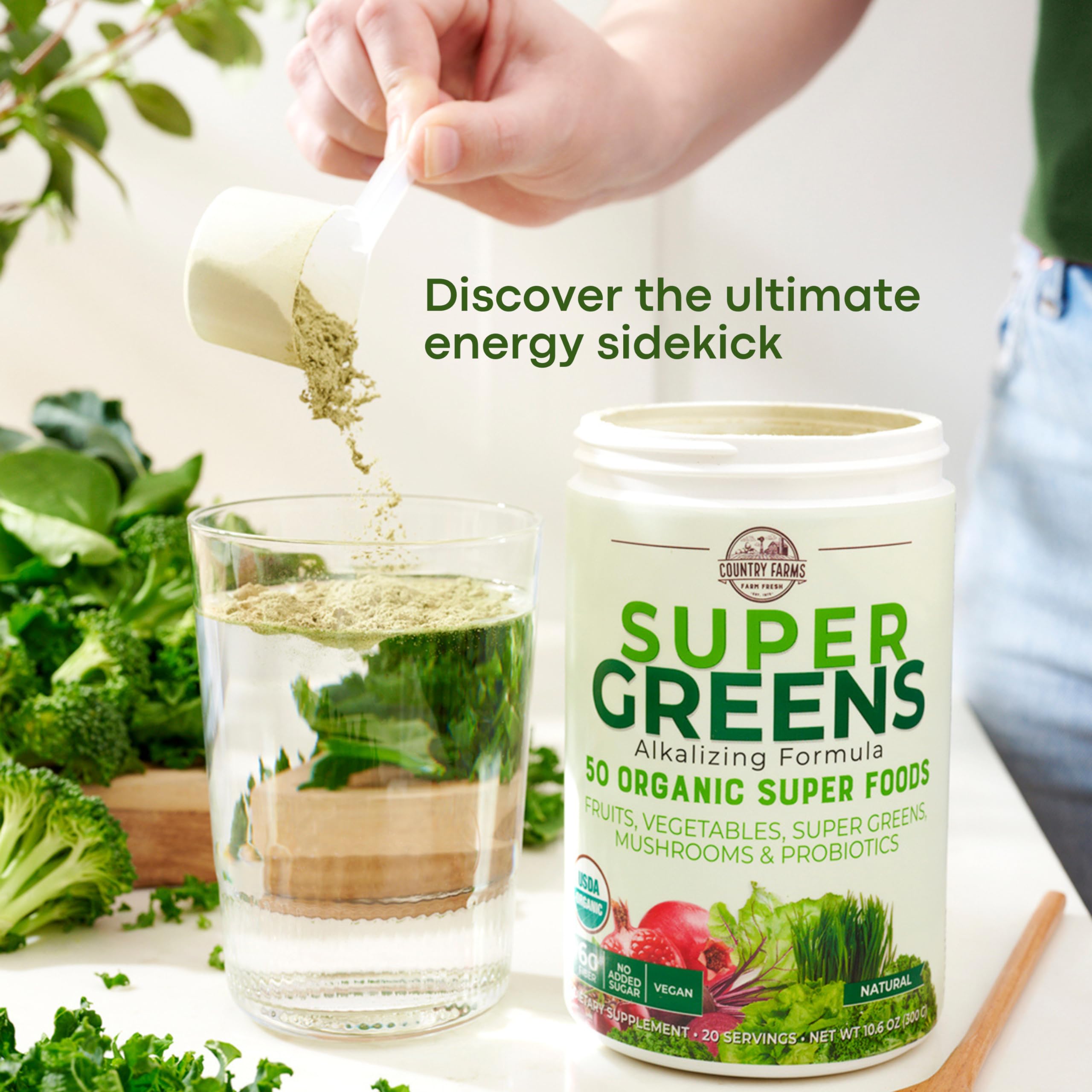 Country Farms Super Greens scoop dispensing image conveys easy portions for fiber-rich meals.