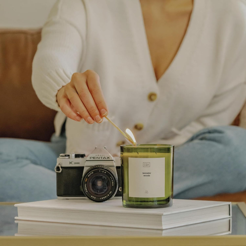 Bedroom scene with Craft & Kin Lavender Woods candle creating calm ambiance