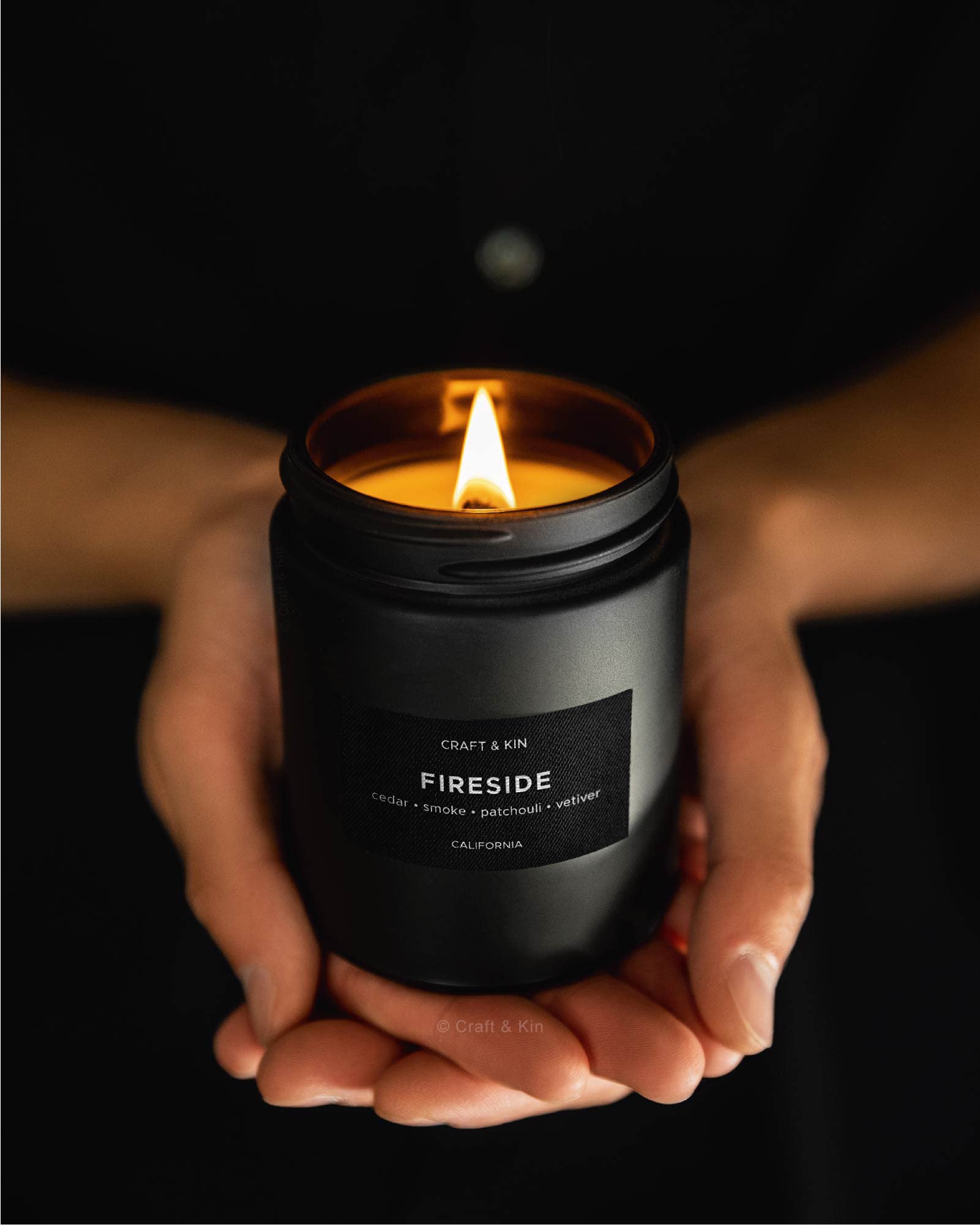 Craft & Kin masculine elegance candle on a coffee table