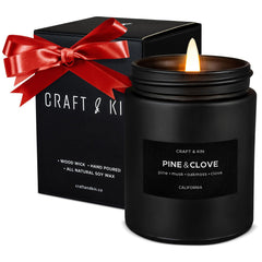 Craft & Kin premium pine & clove candle in black packaging enhances festive ambiance