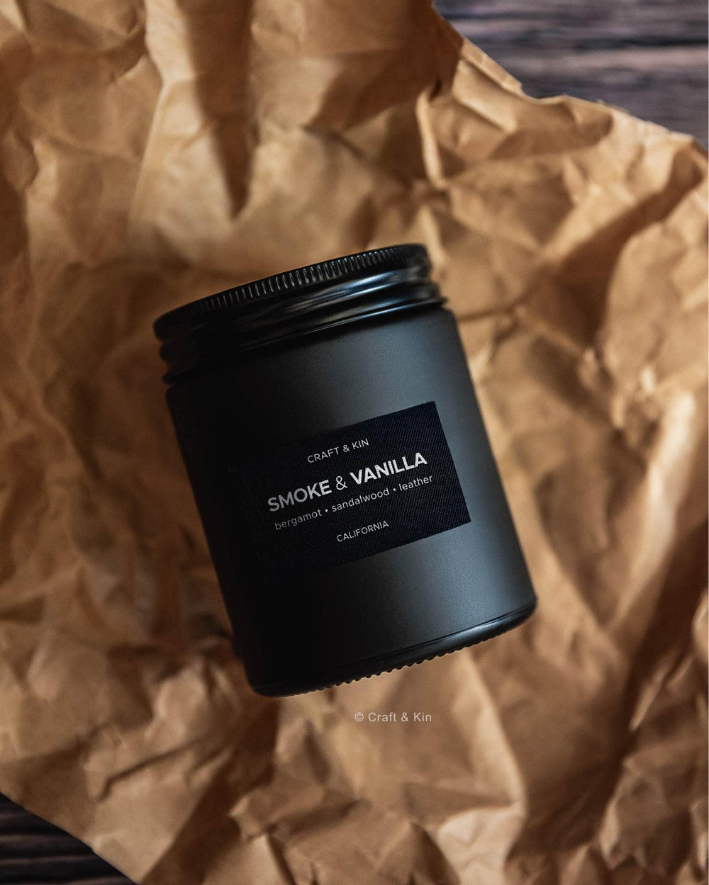 Craft & Kin 7.6oz candle in compact size on shelf.