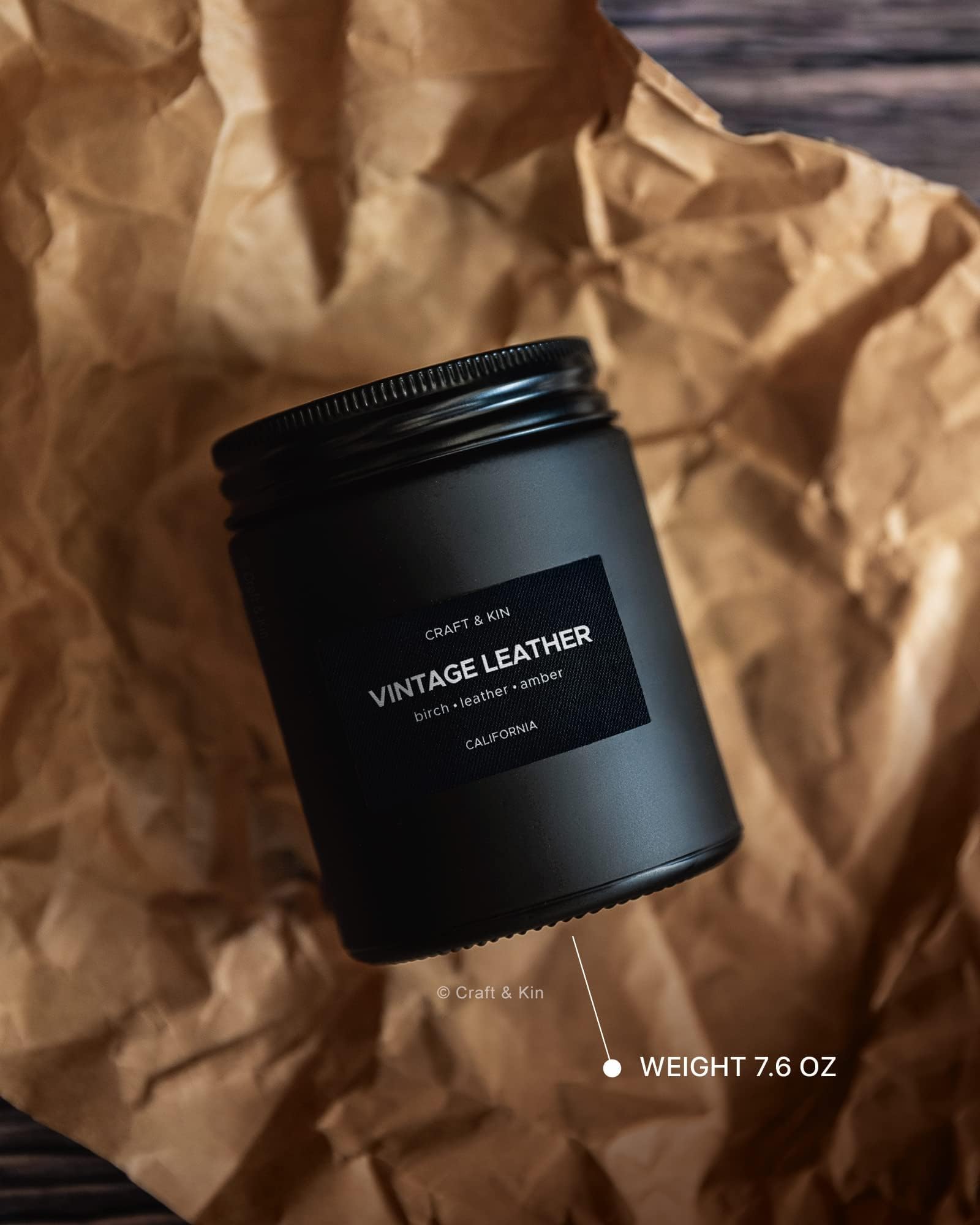 Lifestyle shot of Craft & Kin vintage leather candle in a masculine space.