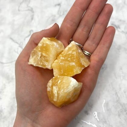 CrystalAge Orange Calcite Healing Crystal on display for calming ambiance and creative focus.