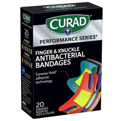 Curad Performance Series bandage showing tough, flexible fabric on a hand
