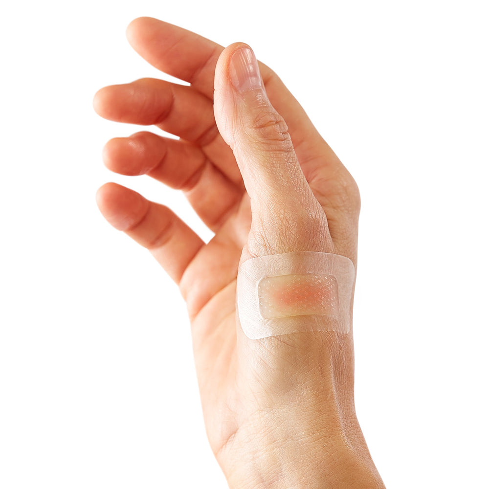 Curad Soothe & Cool burn bandages with waterproof backing shield the wound.