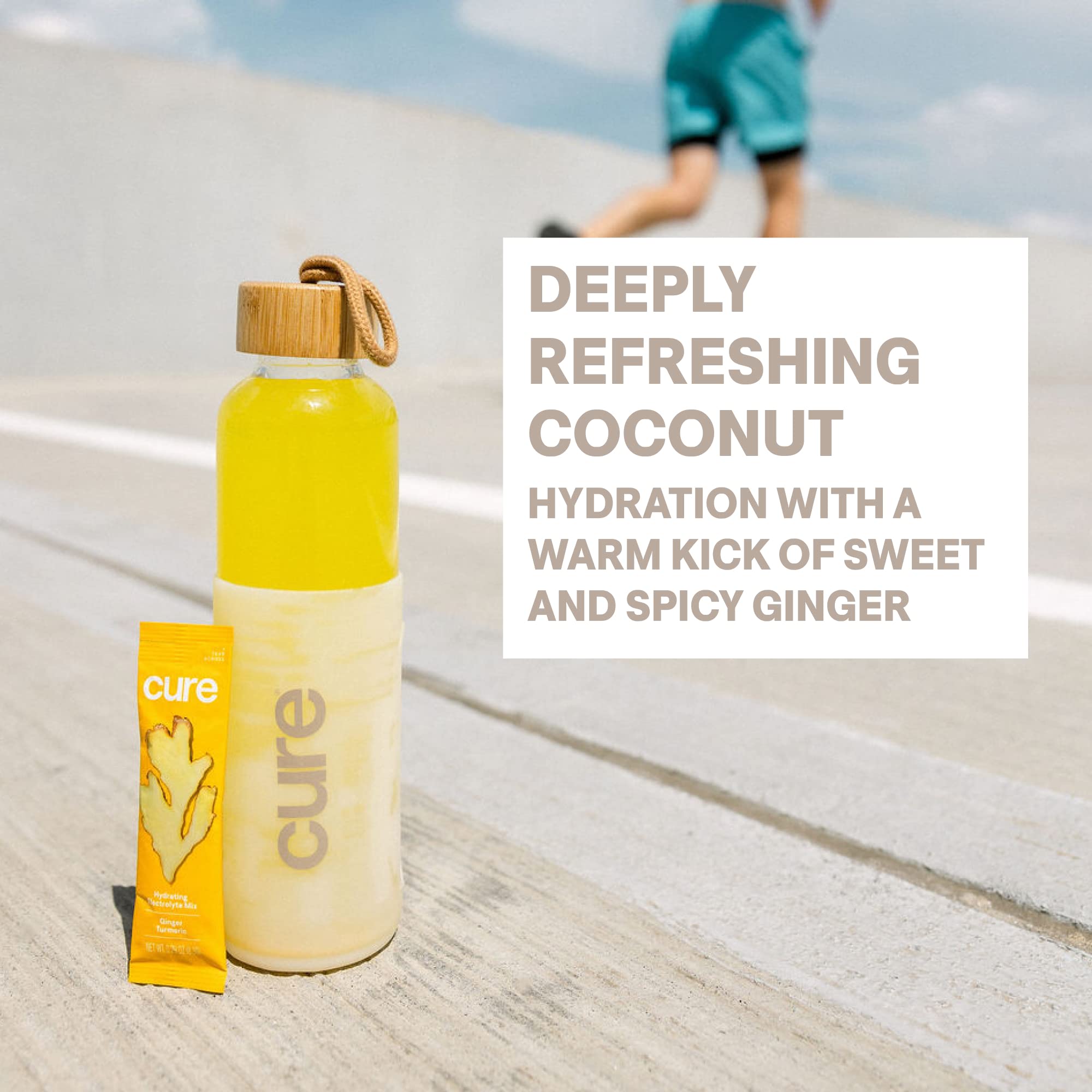 Glass of Cure Hydration Ginger Turmeric drink showing plant-based electrolytes
