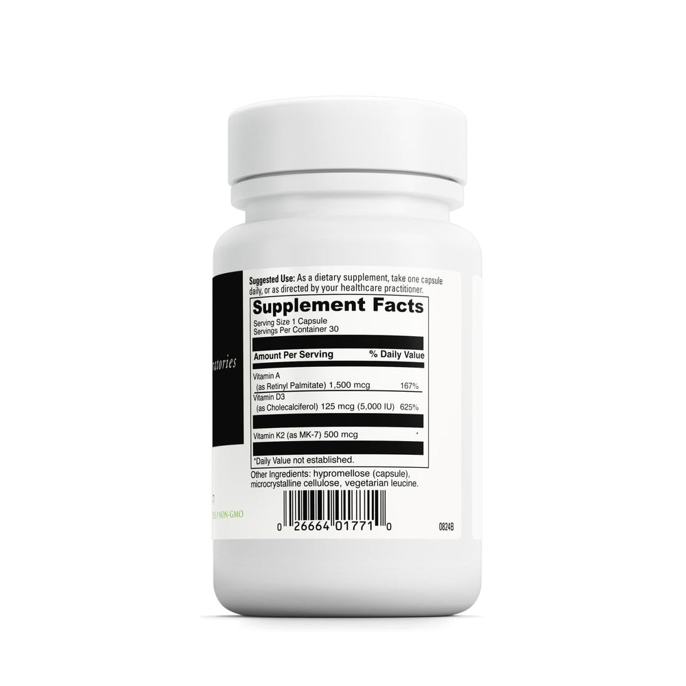 Close-up of ADK capsules highlighting vitamin blend for bone density.