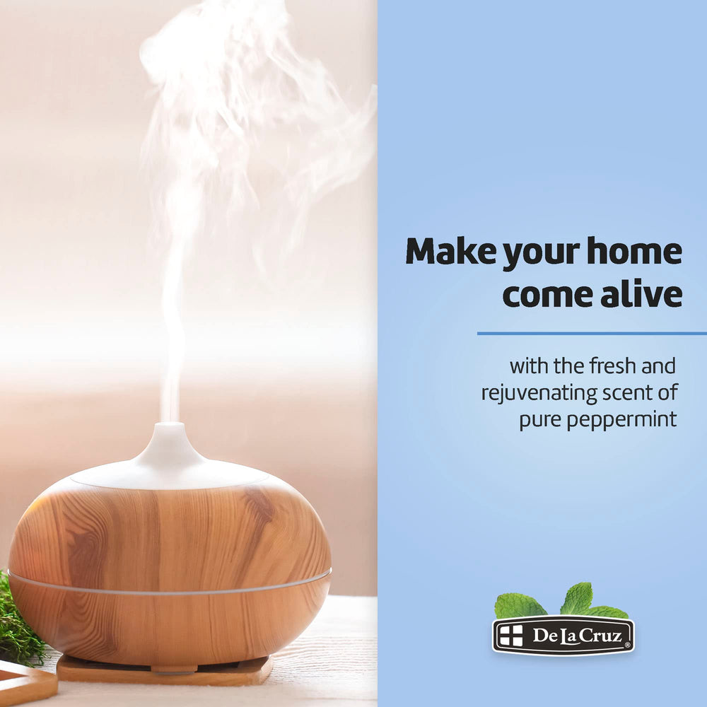 Diffuser scene with De La Cruz Peppermint Oil releasing a mint aroma