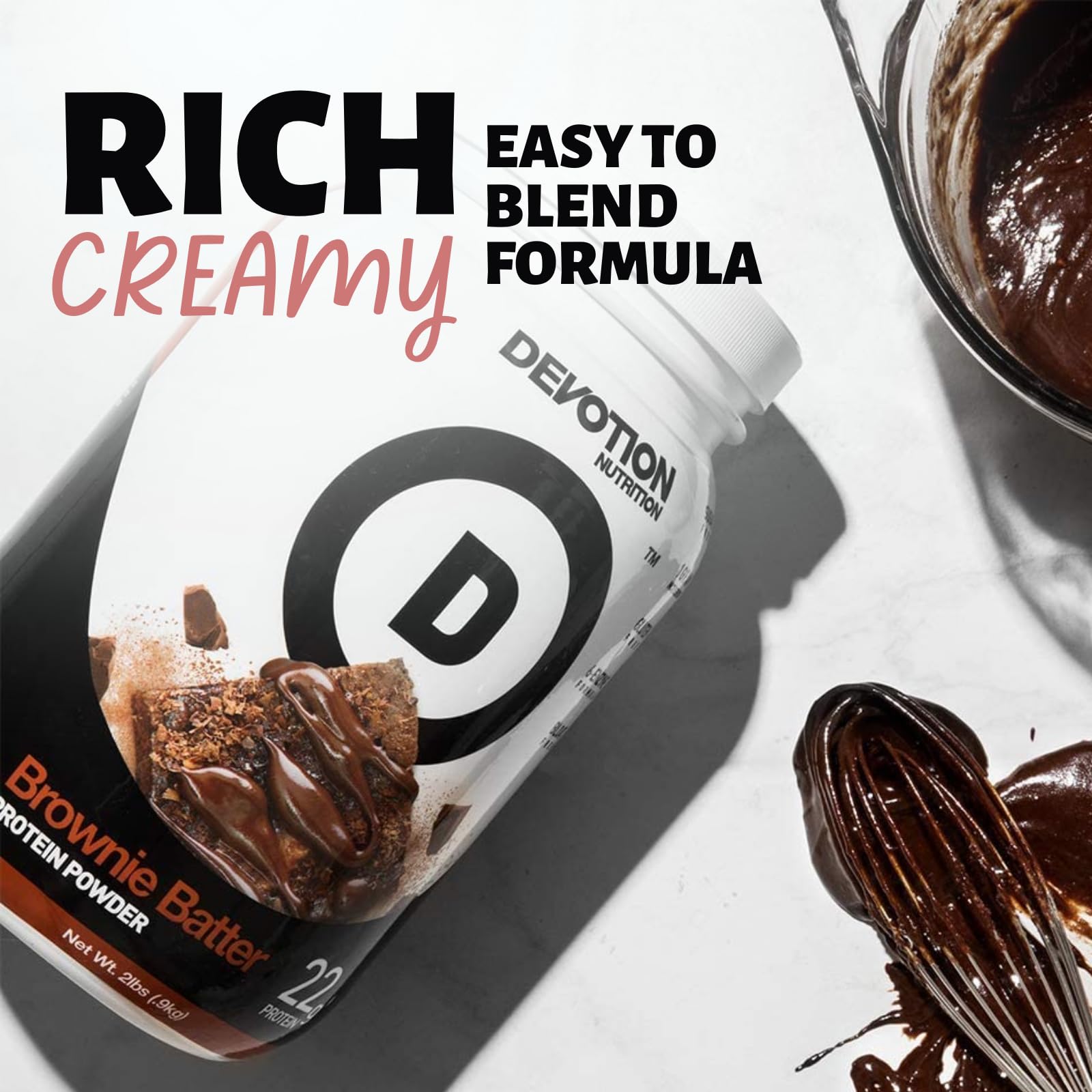 Devotion Nutrition Brownie Batter powder scoop beside open packets for quick mixing.