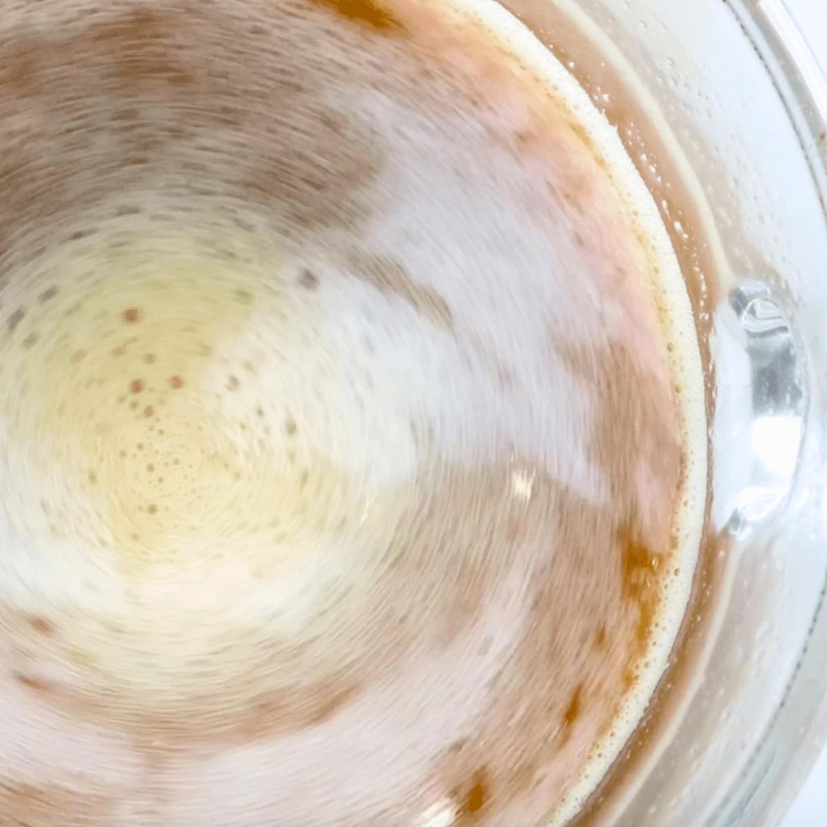 Divine Health Keto Zone MCT Dutch Chocolate pouring into glass for taste