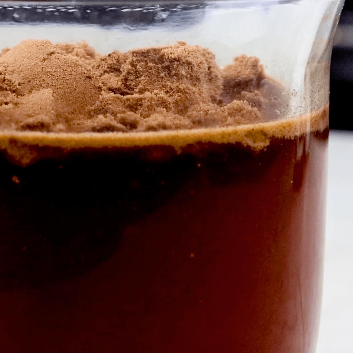 Divine Health Keto Zone MCT Dutch Chocolate serving scoop resting on powder