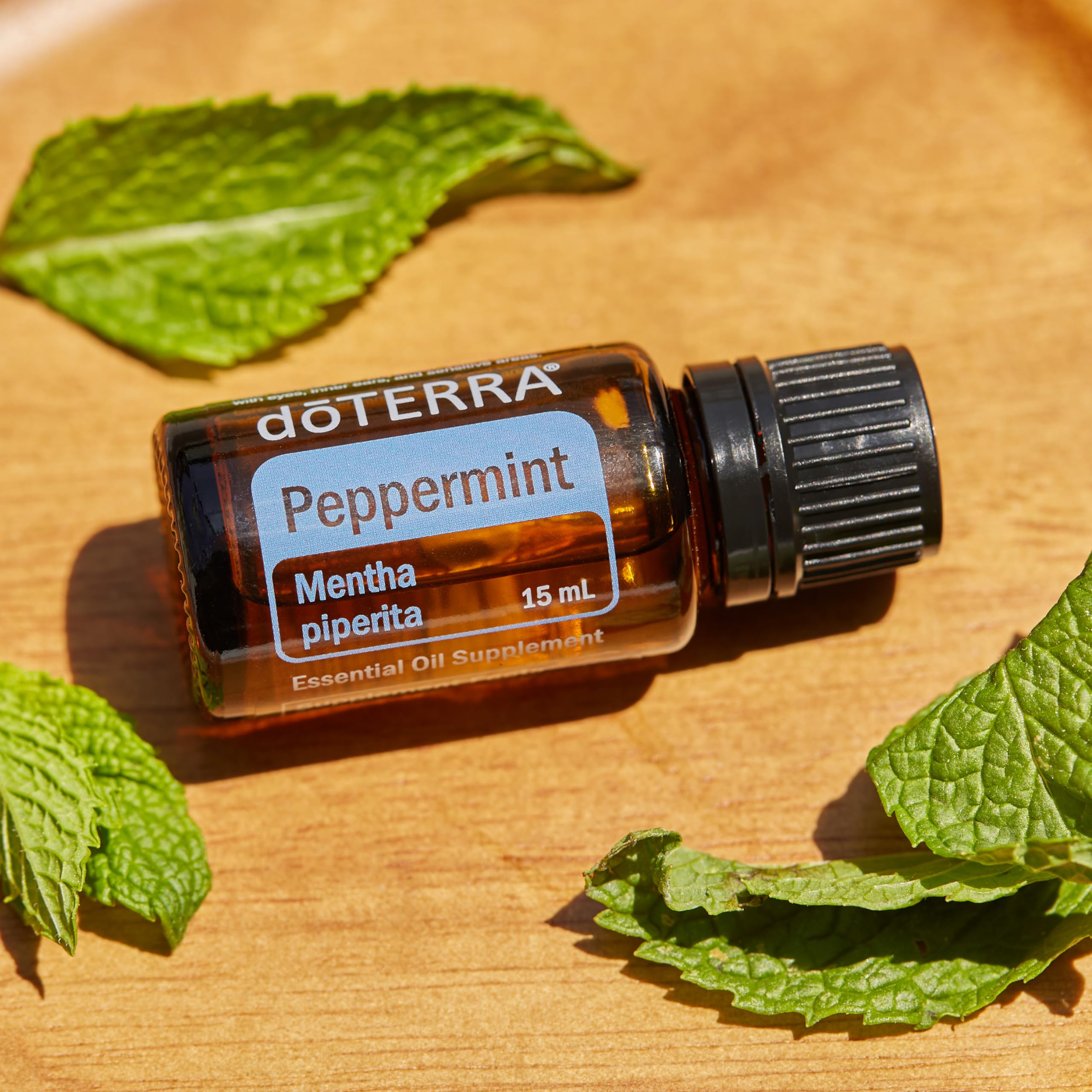 doTERRA peppermint oil with toothpaste highlighting oral care use.