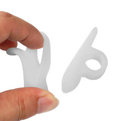 DOMG hammer toe crest pad left worn under socks for daily comfort.
