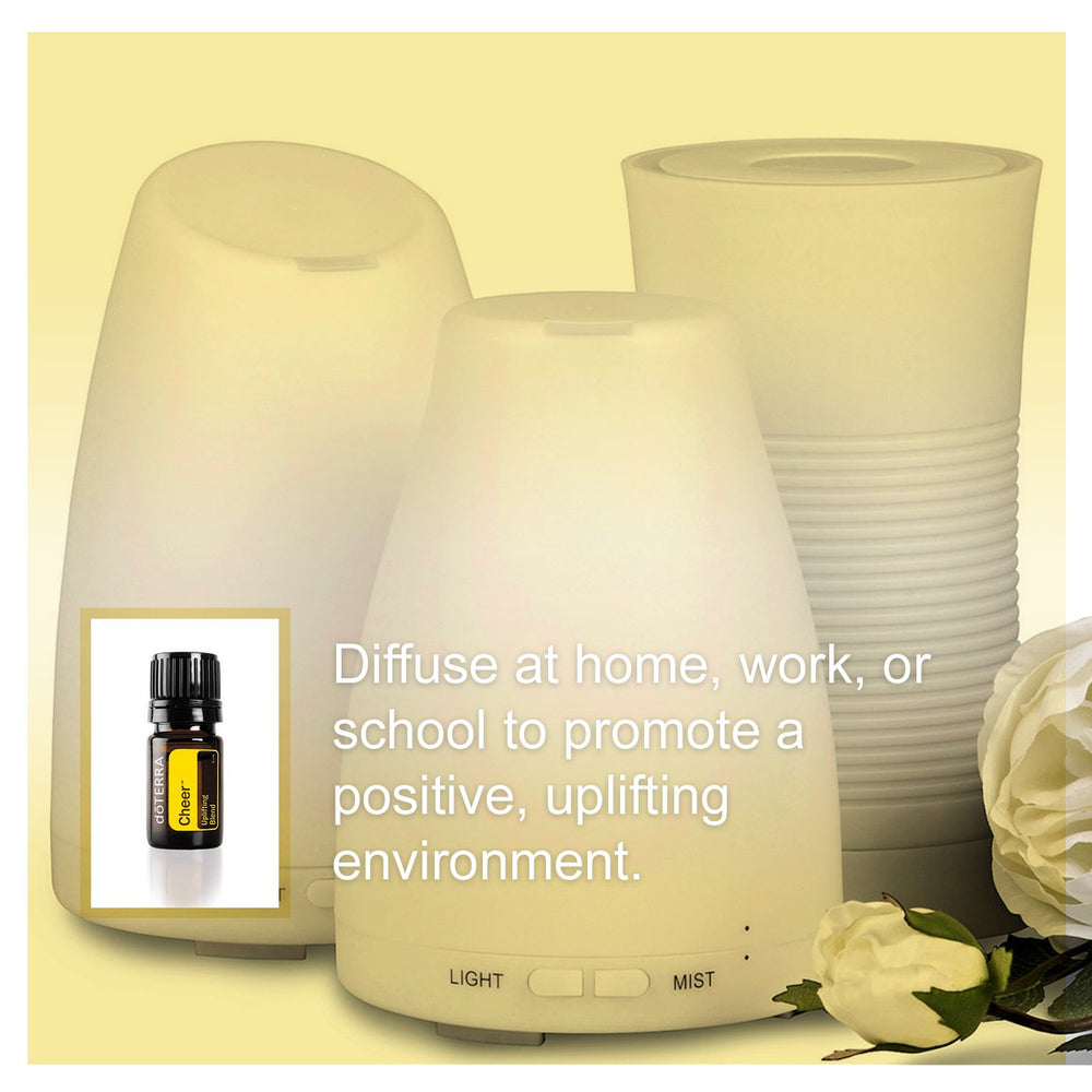 doTERRA Cheer diffuser in a bright room creating cheerful ambiance