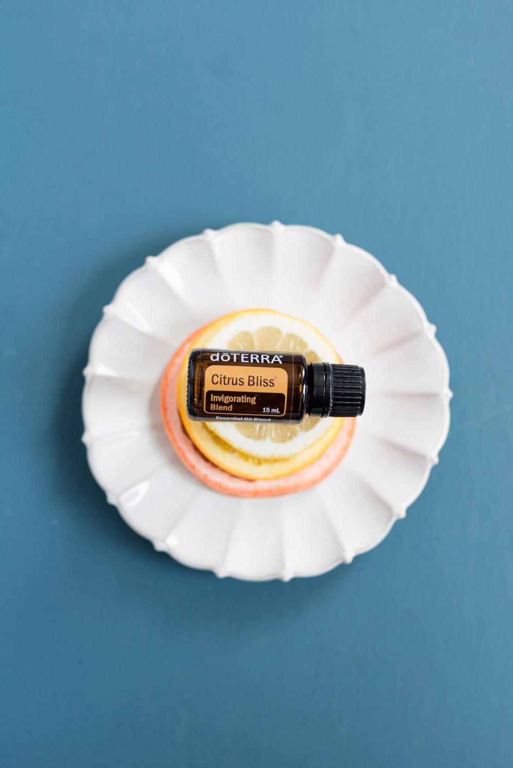 doTERRA Citrus Bliss ingredients top-view highlighting citrus essential oils blend.