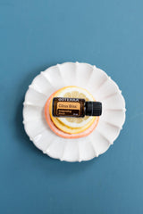 doTERRA Citrus Bliss ingredients top-view highlighting citrus essential oils blend.