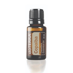 doTERRA Copaiba bottle close-up with resin-rich oil for calming skincare.
