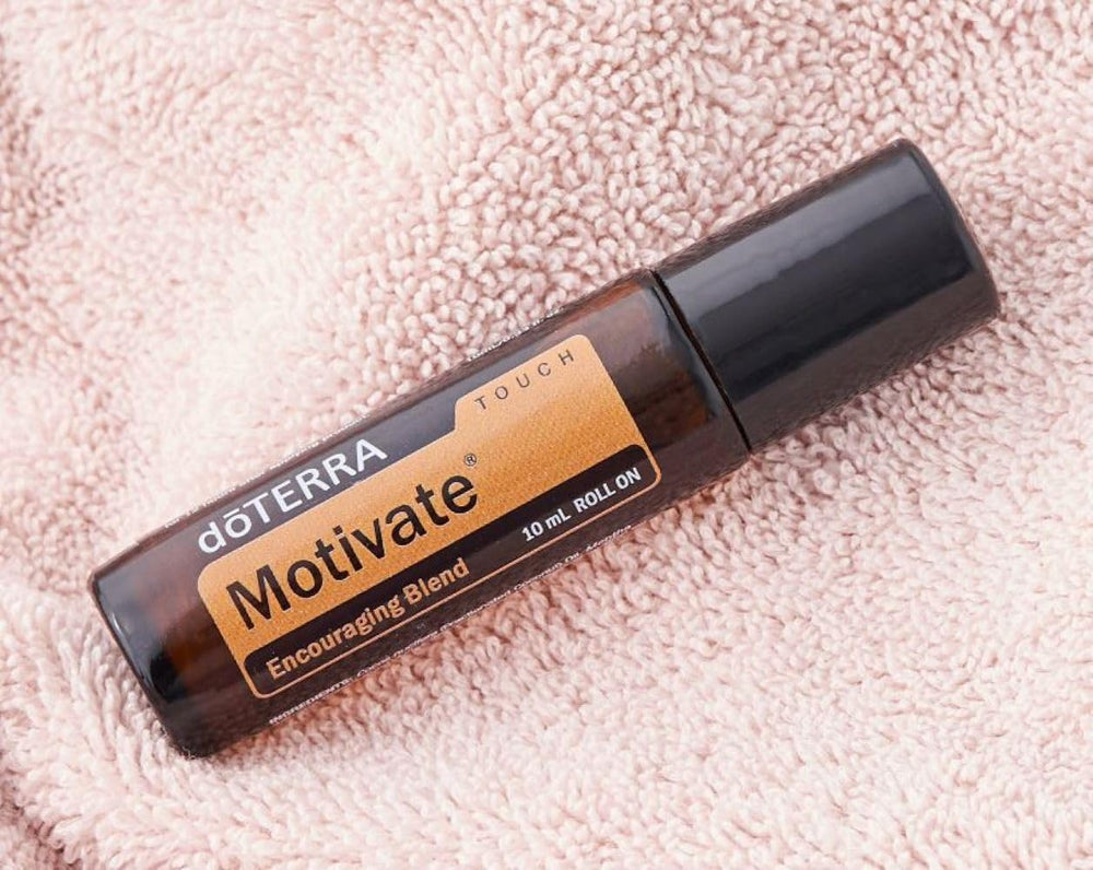 doTERRA Motivate Touch bottle with citrus notes highlighting fresh scent
