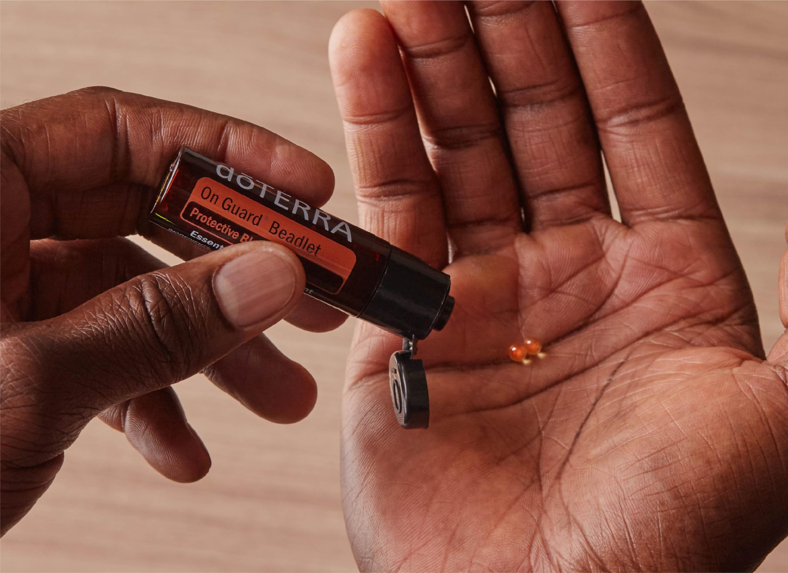 doTERRA On Guard beadlets in a travel-ready bottle for daily protection.