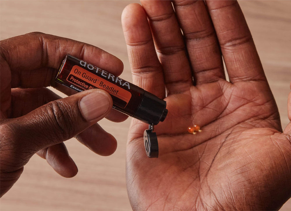 doTERRA On Guard beadlets in a travel-ready bottle for daily protection.